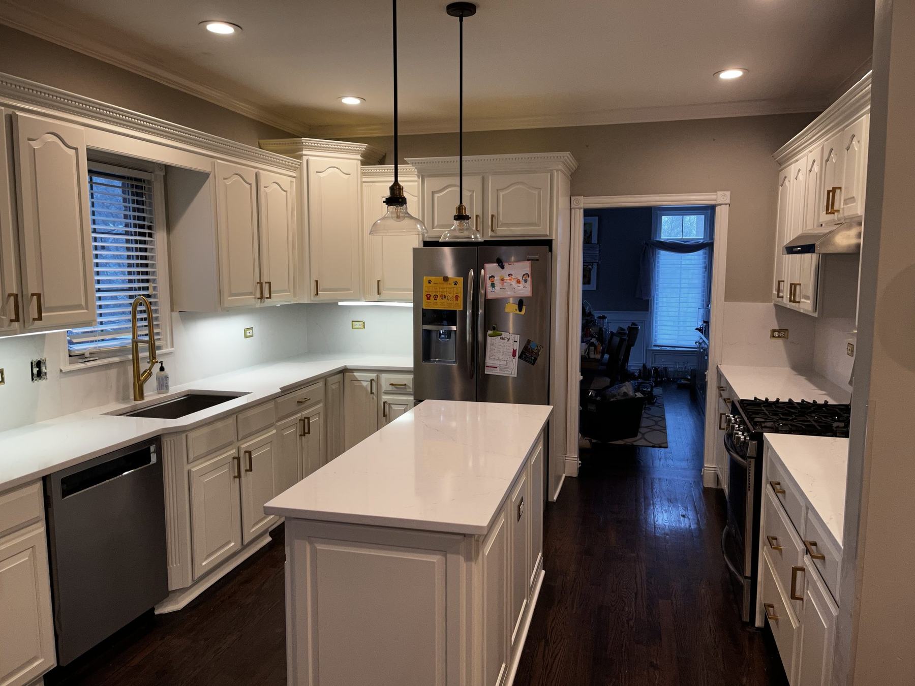 Kitchen with cabinets refinished in white