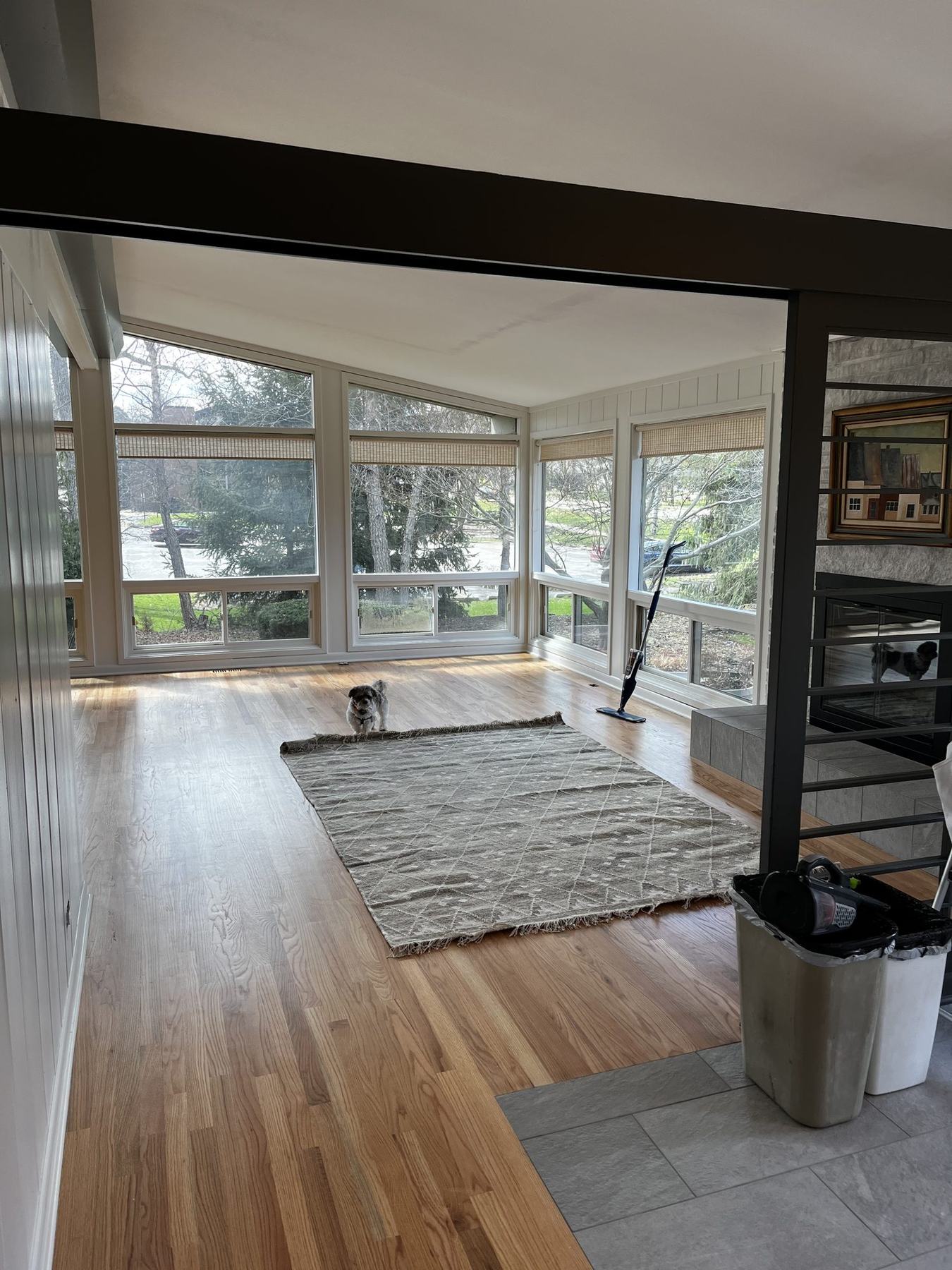 Sunroom with paneled walls painted white